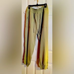 Sage green joggers with elastic waist and drawstring